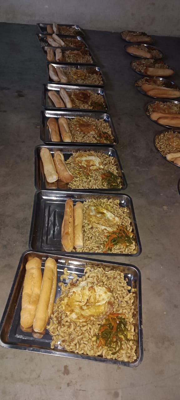 Trays of freshly prepared food ready for distribution